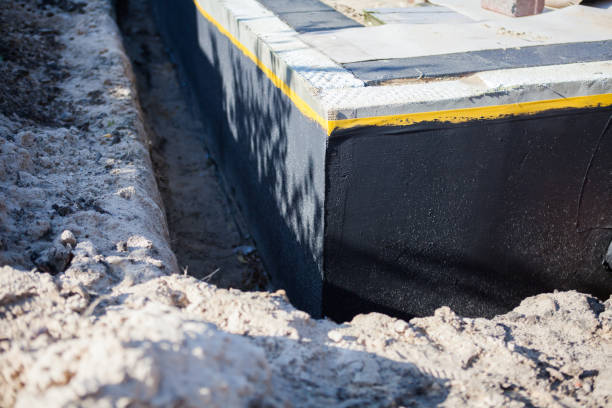 Professional Waterproofing technician working in Elba, NY